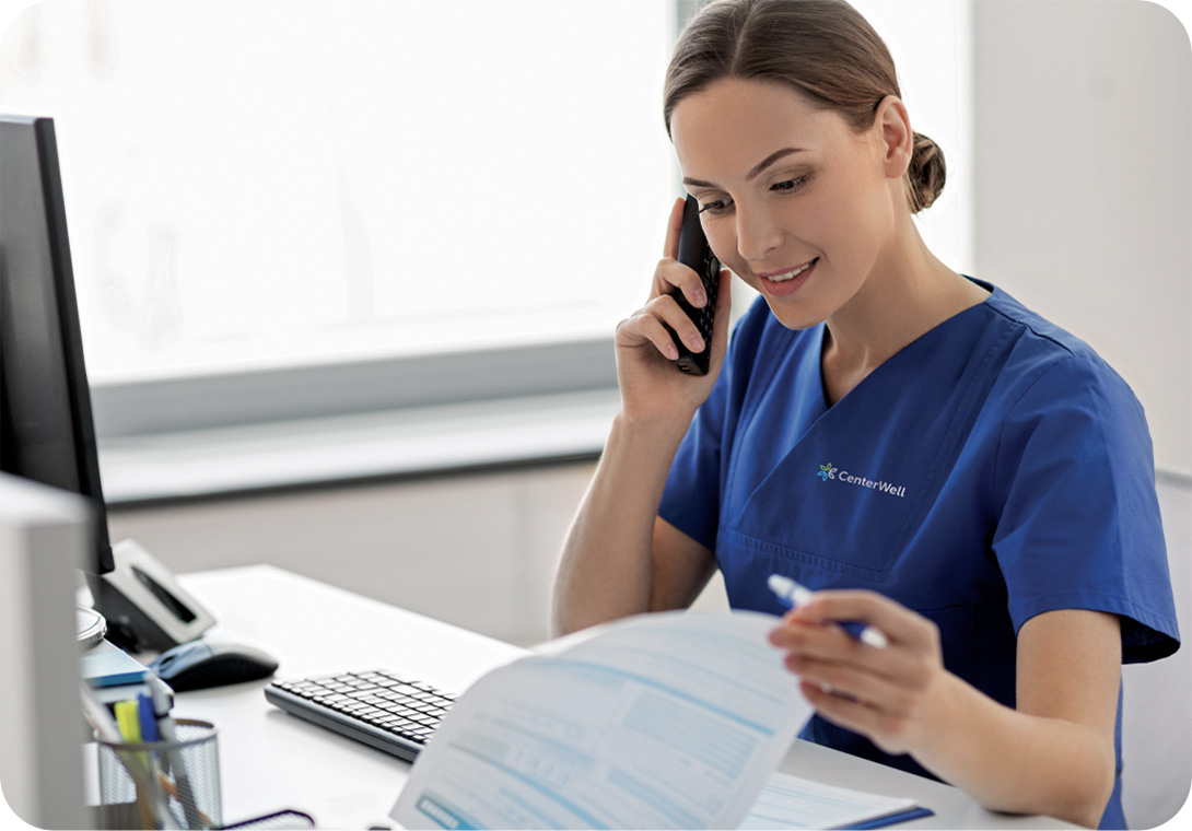 Female clinician happily receives patient calls at the office